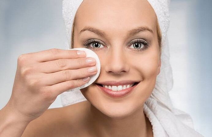 Girl cleanses her face
